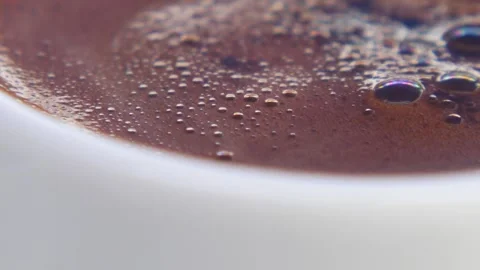 Macro close up of bubbles popping on surface of hot freshly brewed turkish .. Stock Footage 333032599