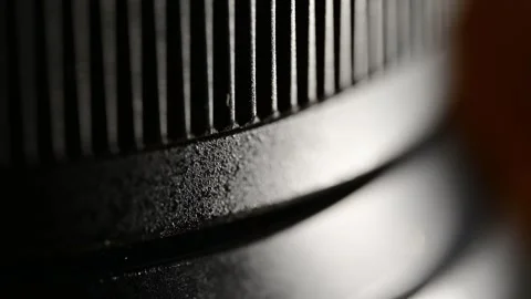 Macro Close Up of a Camera Lens Focus Ring with Metallic Texture Stock Footage 344232489