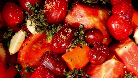 Macro close up of a chef's hand selecting a fresh seasoned cherry tomato Stock Footage 324296893