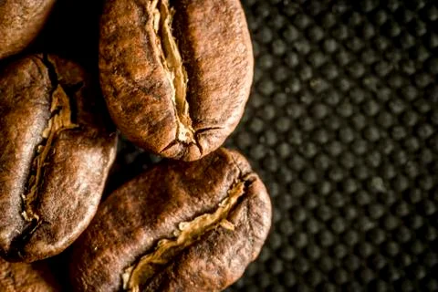 Macro close up of coffee beans on a black background Stock Photos