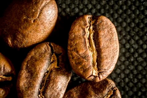 Macro close up of coffee beans on a black background Stock Photos