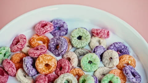 Macro Close Up of Colorful Puffed Cereal with Milk in White Bowl Stock Footage 341962461