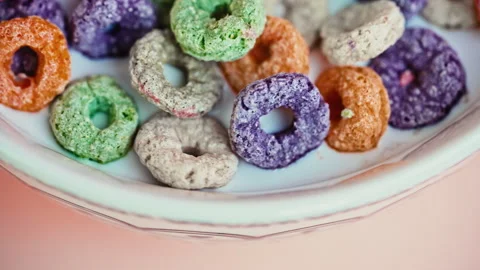 Macro Close Up of Colorful Puffed Cereal with Milk in White Bowl Video stock 341962592