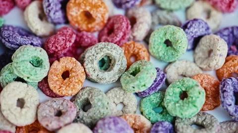 Macro Close Up of Colorful Puffed Cereal with Milk in White Bowl Stock Footage 341962614