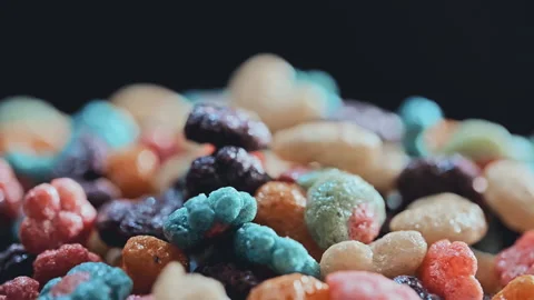 Macro Close Up of Colorful Puffed Cereal with Milk in White Bowl Stock Footage 341962742