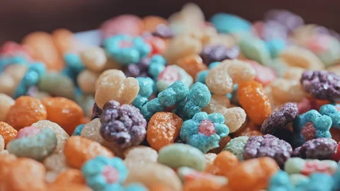 Macro Close Up of Colorful Puffed Cereal with Milk in White Bowl Stock Footage 341962939