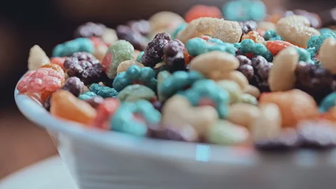 Macro Close Up of Colorful Puffed Cereal with Milk in White Bowl Video stock 341962947