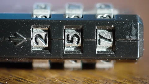 Macro Close Up Of Combination Lock Numbers On Wooden Table Video stock 328582087