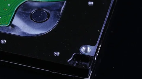 Macro close up of computer hard drive roating around 스톡 동영상 70244821