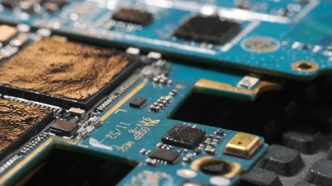 Macro close up computer scorched electrical circuit with chip, slots, microchip 動画素材 270454568