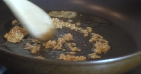 Macro Close Up of Cooking Salmon in Garlic and Butter in Cast Iron Pan Stock Footage 262103021