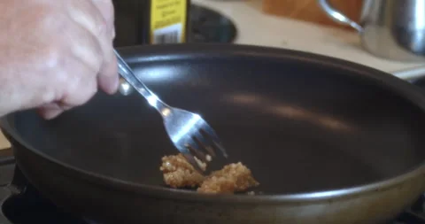 Macro Close Up of Cooking Salmon in Garlic and Butter in Cast Iron Pan Stock Footage 262103426