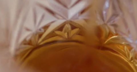 Macro Close Up of Dark Amber Whiskey Being Poured Into Glass Stock Footage 261811129