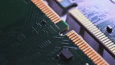 Macro Close Up of DDR4 RAM Gold Contacts with Shifting Colorful Light Stock Footage 344955601