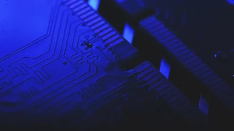 Macro Close Up of DDR4 RAM Gold Contacts with Shifting Colorful Light Stock Footage 344955662