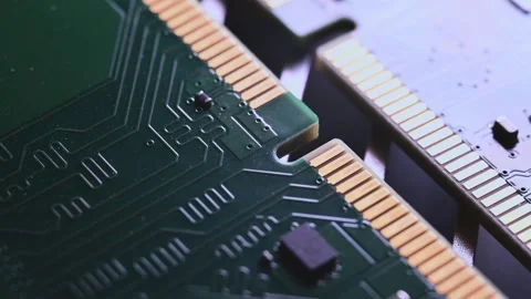 Macro Close Up of DDR4 RAM Gold Contacts with Shifting Colorful Light Stock Footage 344955688