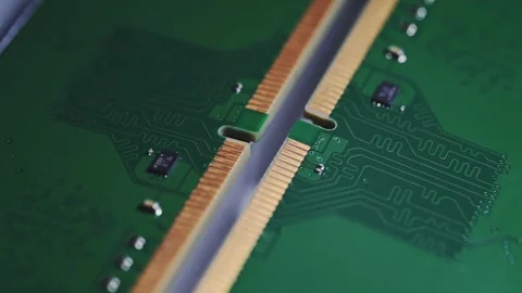 Macro Close Up of DDR4 RAM Gold Contacts with Shifting Colorful Light Stock Footage 344955872