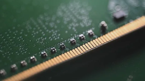 Macro Close Up of DDR4 RAM Gold Contacts with Shifting Colorful Light Stock Footage 344956027