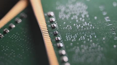 Macro Close Up of DDR4 RAM Gold Contacts with Shifting Colorful Light Stock Footage 344956039