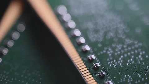 Macro Close Up of DDR4 RAM Gold Contacts with Shifting Colorful Light Stock Footage 344956055