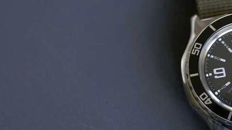 Macro close-up of a diving watch with focus on the second hand. The clock is 스톡 동영상 107532525