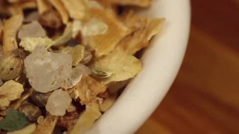Macro close up dolly past white bowl of dried onion spice mix Stock Footage 156454718