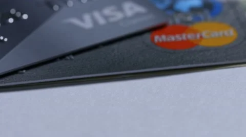Macro close up dolly shot of  two major credit cards Visa and MasterCard and US Stock-Footage 60339936