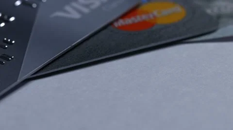 Macro close up dolly shot of  two major credit cards Visa and MasterCard ans Stock-Footage 60350851