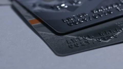 Macro close up dolly shot of  two major credit cards Visa and MasterCard and Stock-Footage 60362172