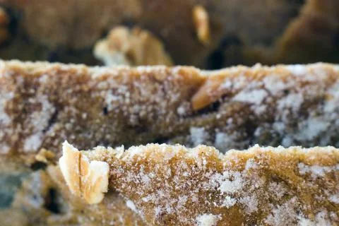 Macro close up of edge of cut loaf of oat bread piled on top of each other. S Stock Photos