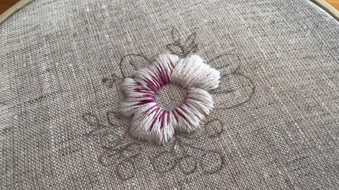 Macro close up of embroidery stitches on fabric, textile detail, pink thread Stock Footage 334182875