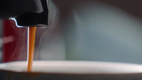 Macro close up espresso coffee dripping into mug Slow motion HD 30p Stock Footage 169760350