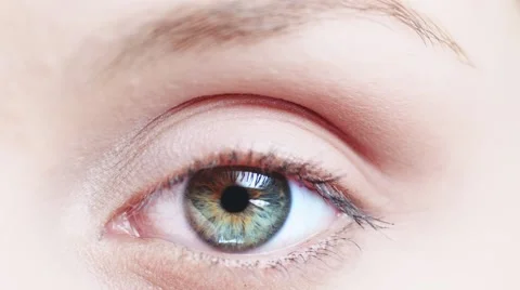 Macro Close-up eye blinking. Young Woman is opening and closing beautiful eye. 库存影片 53815641
