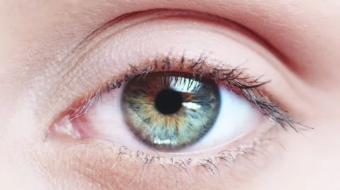 Macro Close-up eye blinking. Young Woman is opening and closing beautiful eye. Stock Footage 53815794