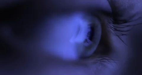 Macro Close-up eye blinking. Young Woman is opening and closing her beautiful Stock Footage 100020465