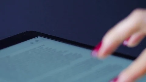 Macro close up of female hand swiping text on an ipad tablet device Stock Footage 70243053