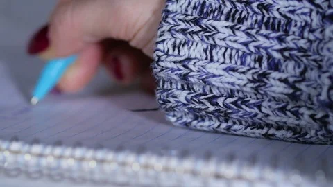 Macro close up of female hand writing in notepad with pen Video stock 70243272