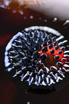 Macro close-up of ferrofluid. Red and blue. Fotos Stock