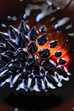 Macro close-up of ferrofluid. Red and blue. Stock Photos