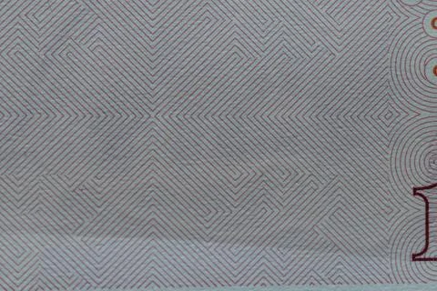 Macro close up of fine geometric security line pattern texture on Chinese b.. Stock Photos