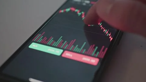 Macro close up of finger touching smartphone screen to analyze stock market Stock Footage 341569697