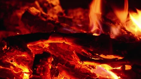 Macro close up of fireplace burning with hot glowing embers and bright flame Video stock 345716446