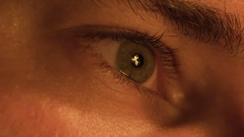 Macro close-up the flame of a fire is reflected in the human male eye and Stock Footage 303574275