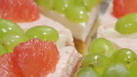 Macro Close Up of Fresh Fruit Tart with Green Grapes and Ruby Red Grapefruit Sli Stock Footage 337751272