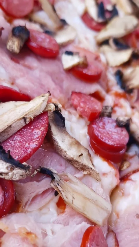 Macro Close Up of Fresh Mushroom and Sausage Pizza Slice Toppings Stock Footage 339079924