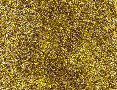 A macro close up of a gold glitter background. Stock Photos