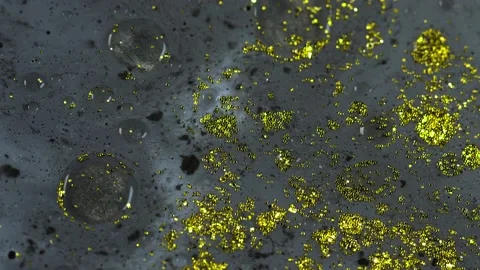 Macro close up of Golden Wet Glitter Particles of acrylic paint and oil. Stock-Footage 150575184