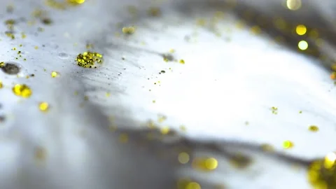 Macro close up of Golden Wet Glitter Particles of acrylic paint and oil. Stock-Footage 150575618