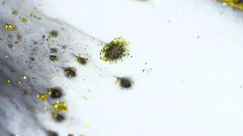 Macro close up of Golden Wet Glitter Particles of acrylic paint and oil. Stock-Footage 150575686