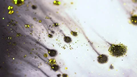 Macro close up of Golden Wet Glitter Particles of acrylic paint and oil. Stock-Footage 150575759